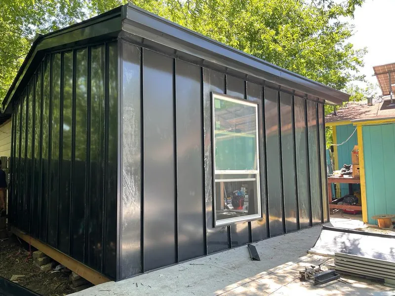 Black standing seam metal wall panels for Roof Inspection in West Fargo