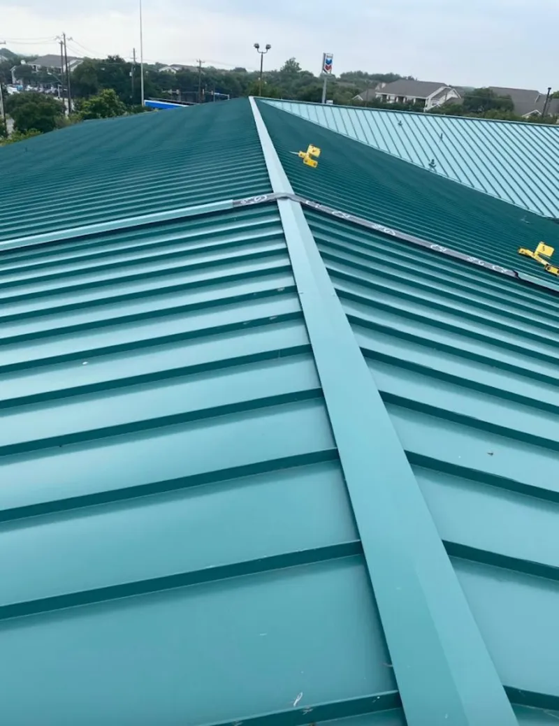 Green commercial metal roof ridge and valley for Metal Roof Repair in West Fargo