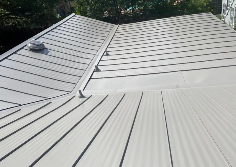 Solar attic fan installed on a metal roof for Roof Ventilation in West Fargo